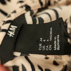 H&M Leopard print dress. Fitted w back zip. 34" long. Waist is about 28"  Size 4